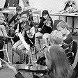 a group of children playing the violin